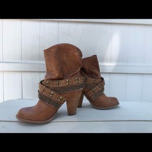 High heeled brown leather boots.